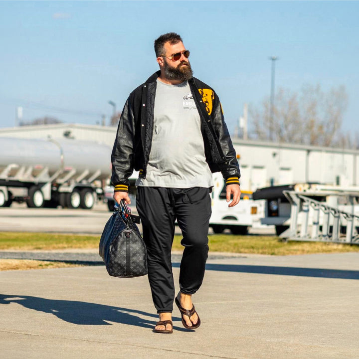 Travis Kelce wearing Olukai sandals