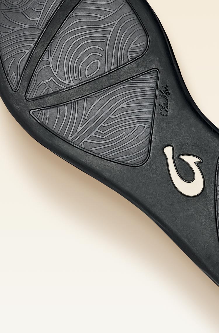 Non-marking rubber outsole with ocean current inspired traction pod design for enhanced grip and durability.