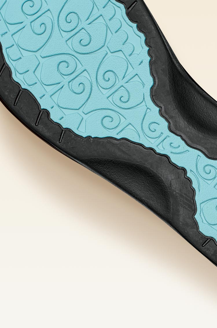 Non-marking rubber outsole with coral reef lug design enhances traction on wet surfaces.