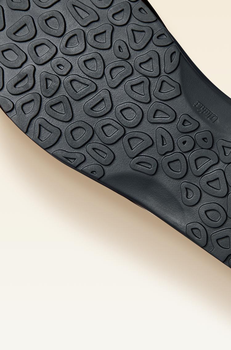 Non-marking rubber outsole with coral reef lug design enhances traction on wet surfaces.